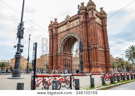 Barcelona - March, 2018: Public Bike System Bicycles Nex To The Triumphal Arch In Barcelona Spain