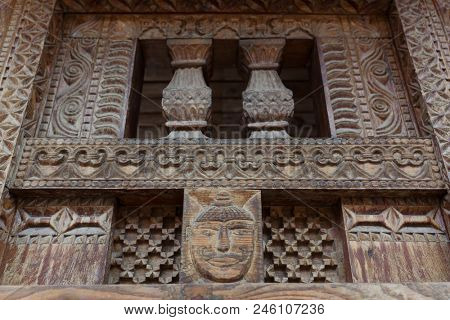 Vashisht, India - May 27, 2017: Traditional wooden carving on the hindu temple in Vashisht village in Kullu valley, Himachal Pradesh, India