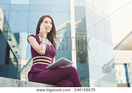 Businesswoman Talking On Mobile And Working With Tablet. Caucasian Insuranse Agent Checking Email An