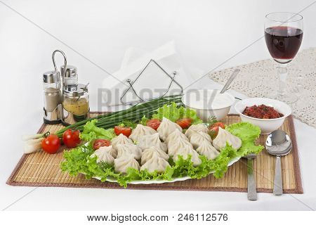 Kinkali In Green With Tomatoes And Onions. Serve With Soy Sauce And Sour Cream.