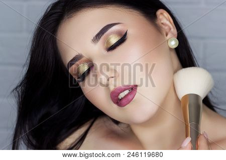 Beautiful Brunette With Professional Make-up