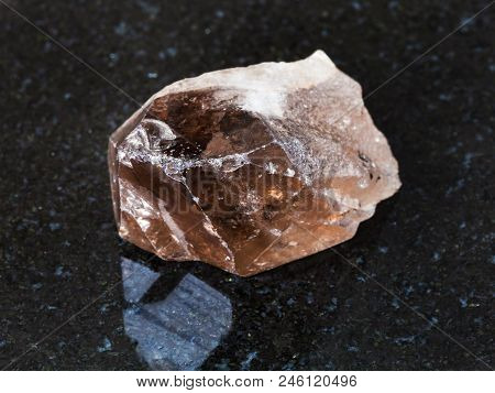 Macro Shooting Of Natural Mineral - Smoky Quartz Crystal On Black Granite From Ural Mountains