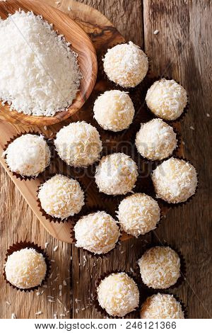 Homemade Brazilian Sweets Beijinhos De Coco With Condensed Milk Close-up. Vertical Top View
