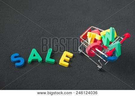 Sale, Discount, Black Friday Concept With Bright Inscription Sale On A Dark Background, Consumer Tro