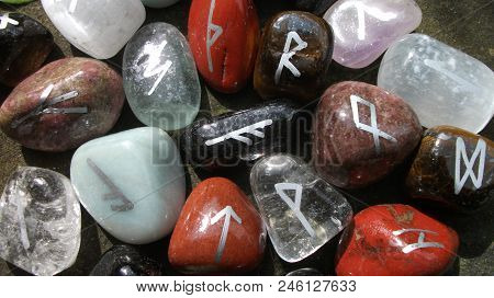 Colourful Runes On A Rock In The Sun.