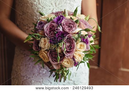 Young Beautiful Bride In White Dress Holding Wedding Bouquet, Bouquet Of Bride From Rose Cream Spray