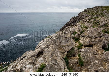 Coastal cliffs near of the beach Gulpiyuri, Asturias, Spain