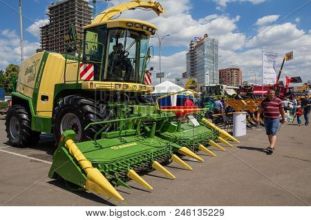 Kiev, Ukraine - June 07, 2018: Visitors To View Samples Of Agricultural Machinery To The Exhibition 