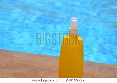 Summer-yellow Sunblock Cream In Blue Outdoor Swimming Pool