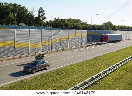 The Motorway Is Protected Against Noise Emission By Noise-absorbing Barrier (also Called A Soundwall