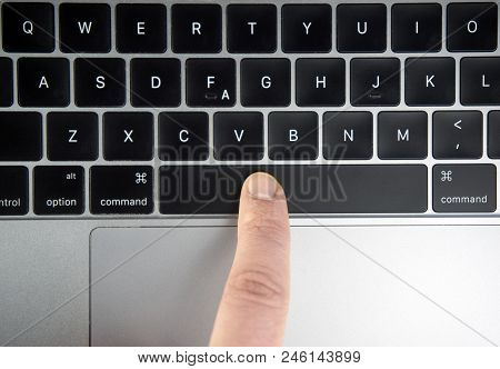 Finger Pushing The Space Bar Button Of Keyboard