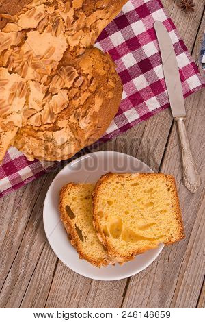 Easter Dove Bread Colomba Pasquale On Wooden Table.