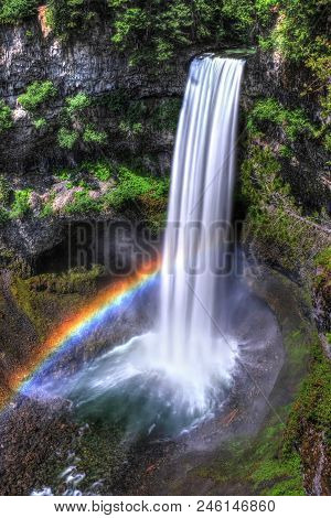 Rainbow Over Waterfalls In Sunny Day. Brandywine Falls Near Whistler Village. Vancouver. Beautiful B