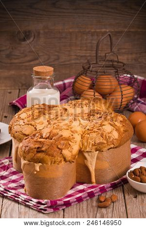 Easter Dove Bread Colomba Pasquale On Wooden Table.