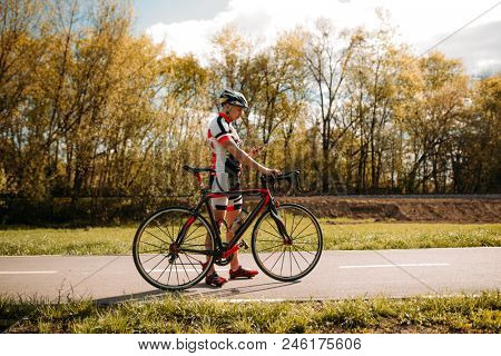 Cyclist, cyclocross training on bike path