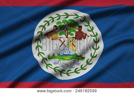 Belize Flag  Is Depicted On A Sports Cloth Fabric With Many Folds. Sport Team Waving Banner