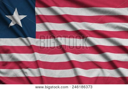 Liberia Flag  Is Depicted On A Sports Cloth Fabric With Many Folds. Sport Team Waving Banner