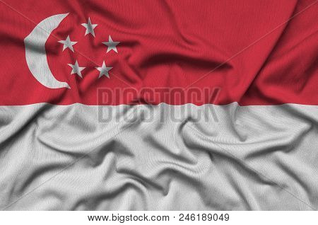 Singapore Flag  Is Depicted On A Sports Cloth Fabric With Many Folds. Sport Team Waving Banner