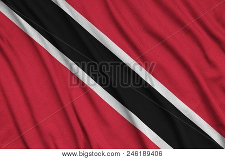 Trinidad And Tobago Flag  Is Depicted On A Sports Cloth Fabric With Many Folds. Sport Team Waving Ba