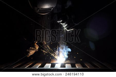 Welder Connects The Part With Manual Arc Welding
