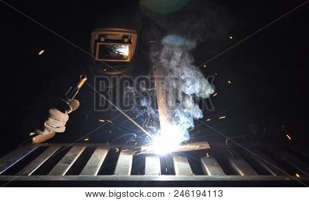Welder Connects The Part With Manual Arc Welding