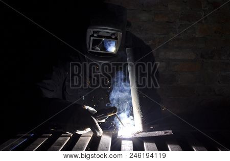 Welder Connects The Part With Manual Arc Welding