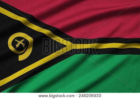 Vanuatu Flag  Is Depicted On A Sports Cloth Fabric With Many Folds. Sport Team Waving Banner