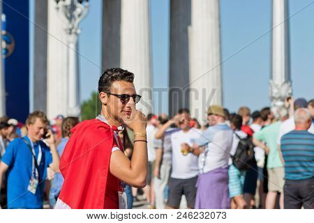 Football Fans Of The National Team Of Tunisia With National Flags And Attributes