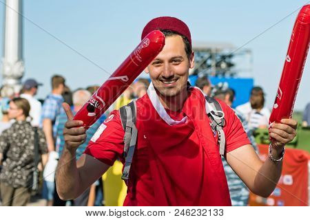 Football Fans Of The National Team Of Tunisia With National Flags And Attributes