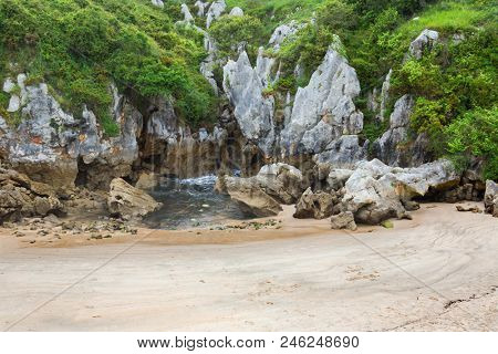 the famous beach gulpiyuri, in Asturias, Spain