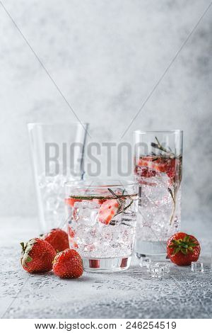 Alcoholic Or Non-alcoholic Cocktail With Strawberries And Rosemary And Ice In Glass Glasses. Free Sp