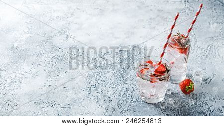 Alcoholic Or Non-alcoholic Cocktail With Strawberries And Rosemary And Ice In Glass Glasses. Free Sp