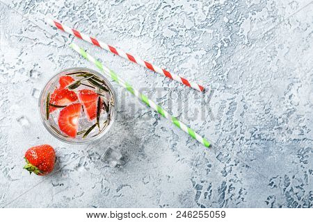 Alcoholic Or Non-alcoholic Cocktail With Strawberries And Rosemary And Ice In Glass Glasses. Free Sp