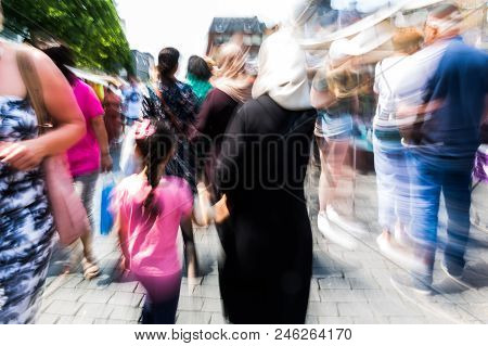 Abstract Picture With Camera Made Zoom Effect Of People Walking In The City With Zoom Effect