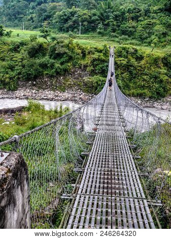 Suspension Bridge Over Marsyangdi River, Rainy Weather Near Besisahar, Annapurna Circuit Trek In Nep