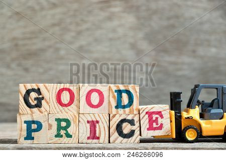 Toy Forklift Hold Letter Block E To Complete Word Good Price On Wood Background