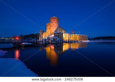 Medieval Fortress Of Savonlinna In The Winter Night Landscape. Finland