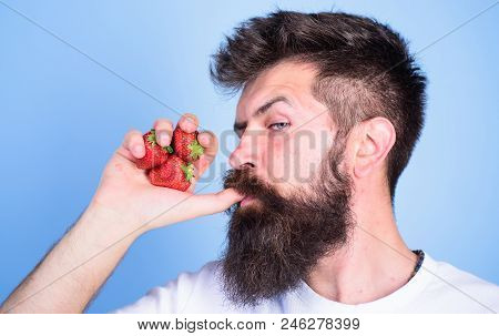 Man Strict Face Enjoy Fresh Drink Strawberry Juice. Fresh Juice Concept. Man Drinks Strawberry Juice