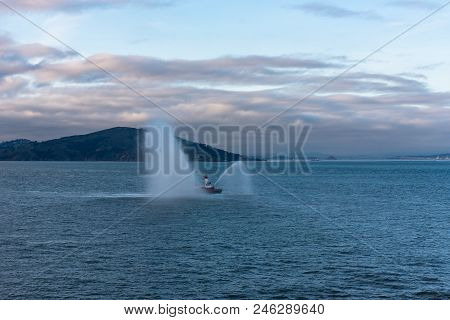 San Franciso, Ca -- January 25, 2016. A Fireboat Tests Its Water Hoses In San Francisco Bay Under A 