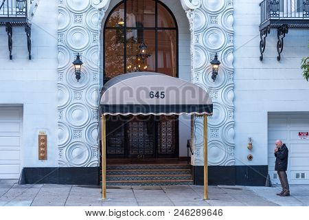 San Franciso, Ca -- January 23, 2016. Man Lights A Smoke Outside A Hotel In San Francisco.