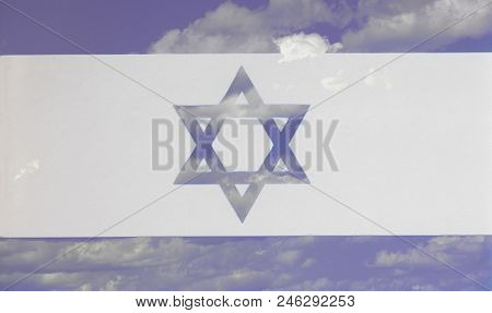 Flag Of Israel A Background Of Blue Sky And Clouds Closeup