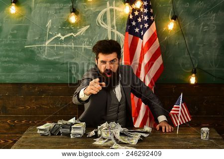 Businessman With Money And United States Flag Representing A Strong U.s. Economy, Strength Of The Am