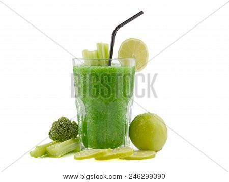 A Glass Of Green Smoothies With A Straw Is Made Lemons, Lettuce And Broccoli, Situated On The White 