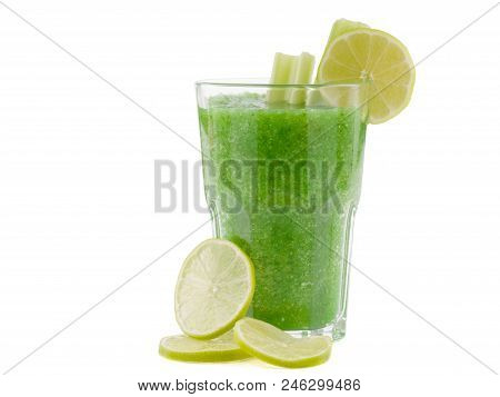 A Glass Of Green Smoothies Made Of Peppers Is Situated On The White Background.