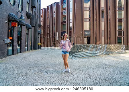June 10, 2018. Tallinn, Estonia. Young Girl Exploring Tallinn City Including Old Town, Modern Distri