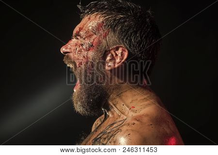 Fury. Hipster Shout With Bloody Beard On Brutal Face Profile. Bearded Man With Tattoo On Chest On Bl