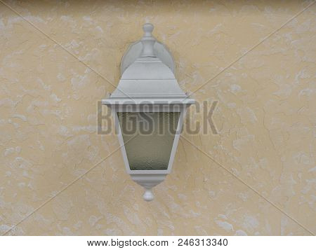Rustic Light Is Off On Concrete Wall. Textured Background. Close Up.