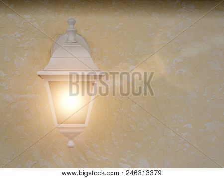 Rustic Light Is Lighting On On The Concrete Wall. Light Is Switched On. Textured Background. Close U