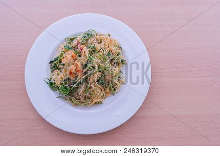 Thin Rice Noodles Stir Fried With Shrimp And Water Minosa Or Mee Phat Krachet Koong In Thai Top View