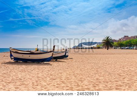 Beach At Seaside In Calella In Catalonia, Spain Near Barcelona. Scenic Old Town With Sand Beach And 